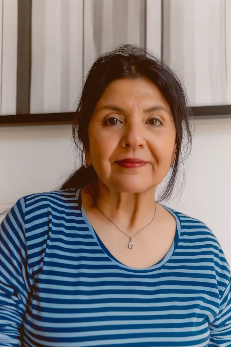 Mujer 59 anos satisfeita.webp__PID:bda146ed-5ee8-4963-9441-b156475d708d